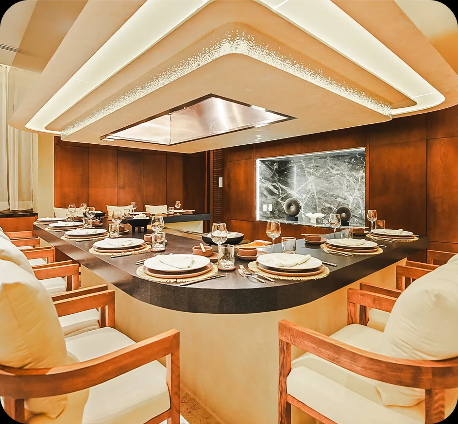 Private dining beneath sculptural lighting