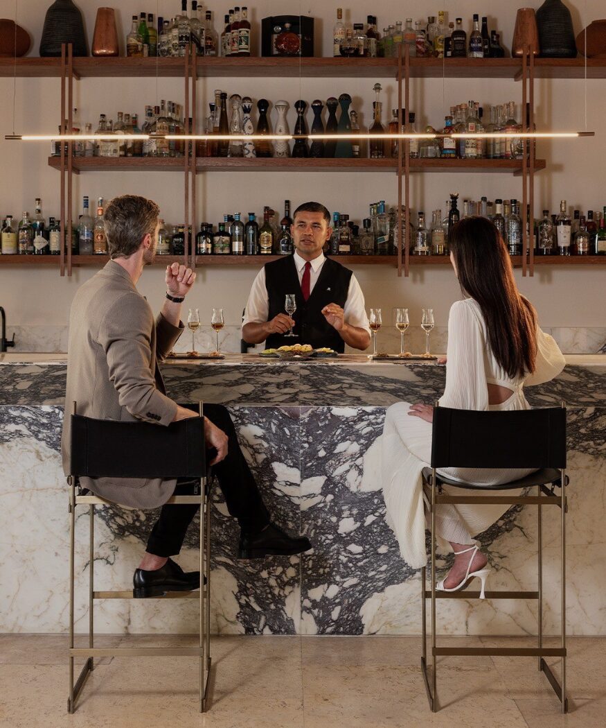 couple enjoying drink in a bar