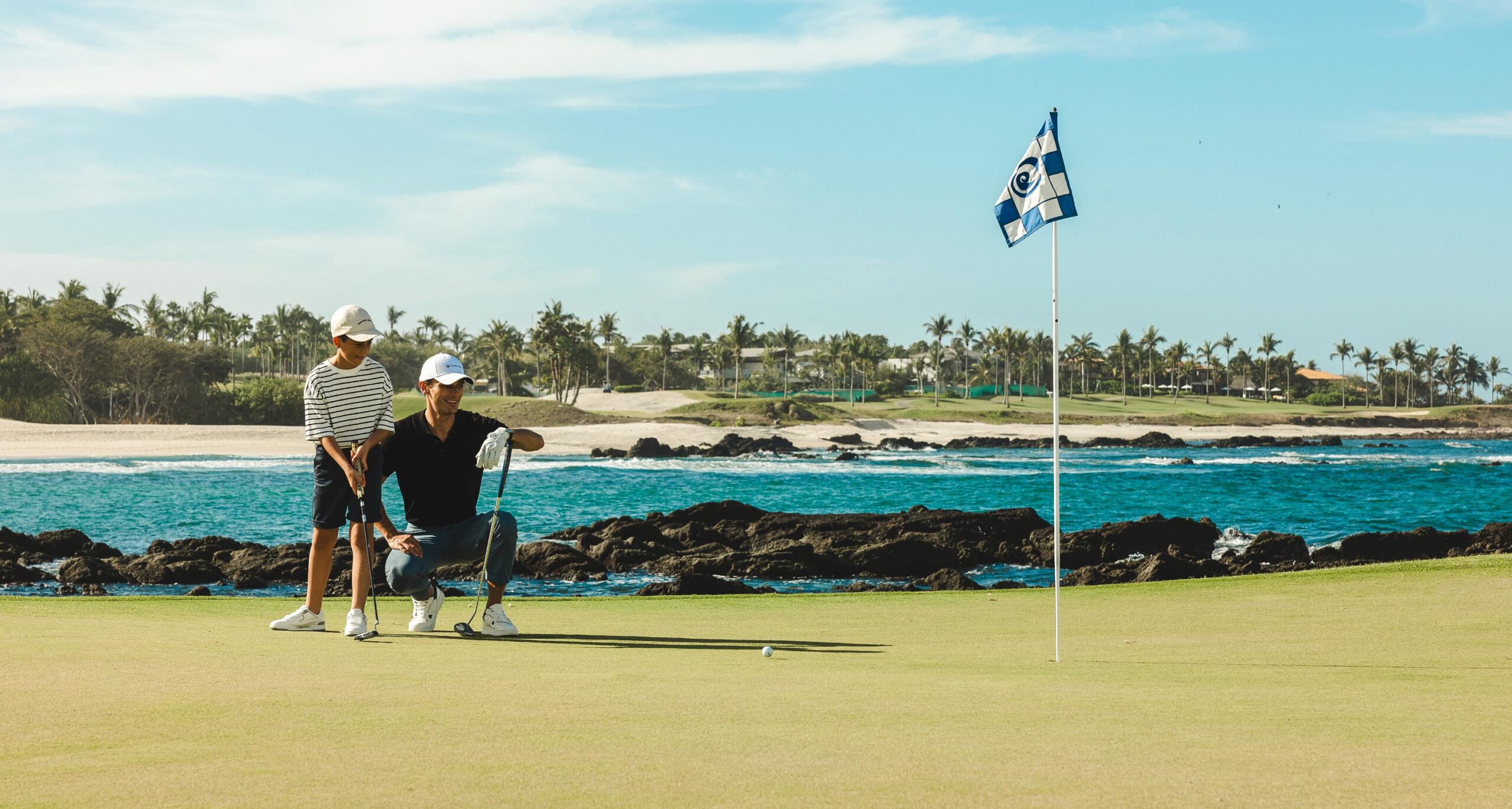 father and son playing golf