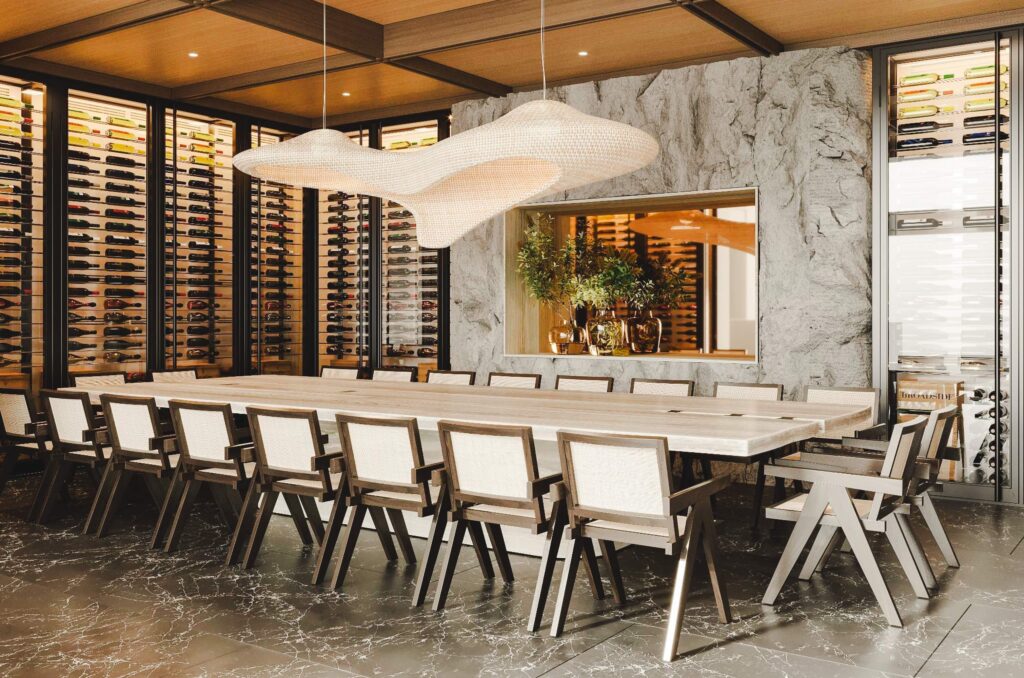 Dining area with with wall full of wine collections